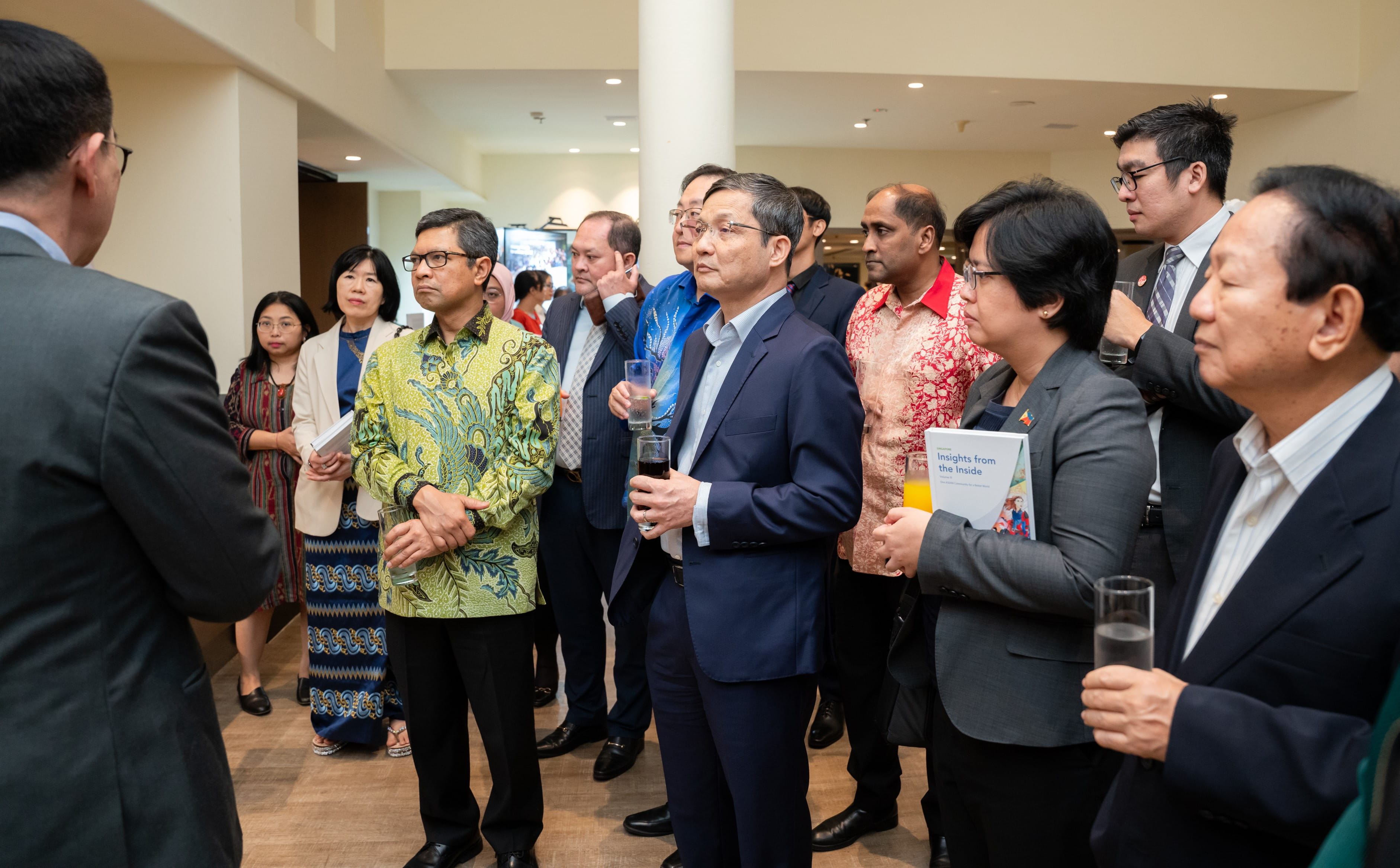 Guests from the diplomatic community on a tour of exhibits about SIF's initiatives in Vietnam