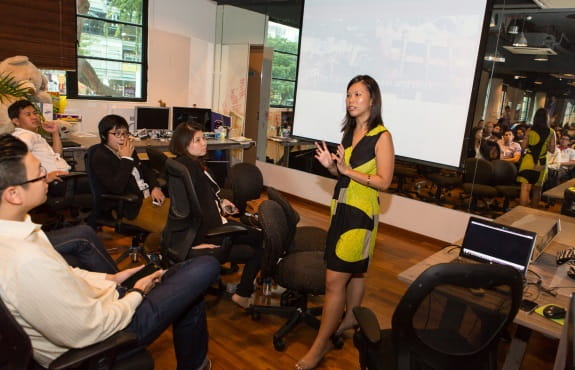 The Hub co-founder Grace Sai (standing) explains her vision of connecting and enabling social entrepreneurs through a common space.